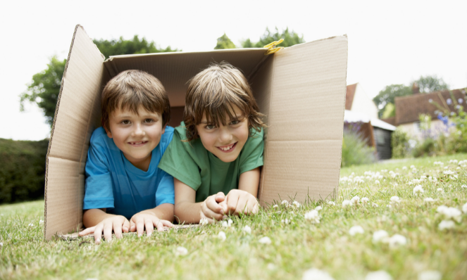 kids playing outside in a box