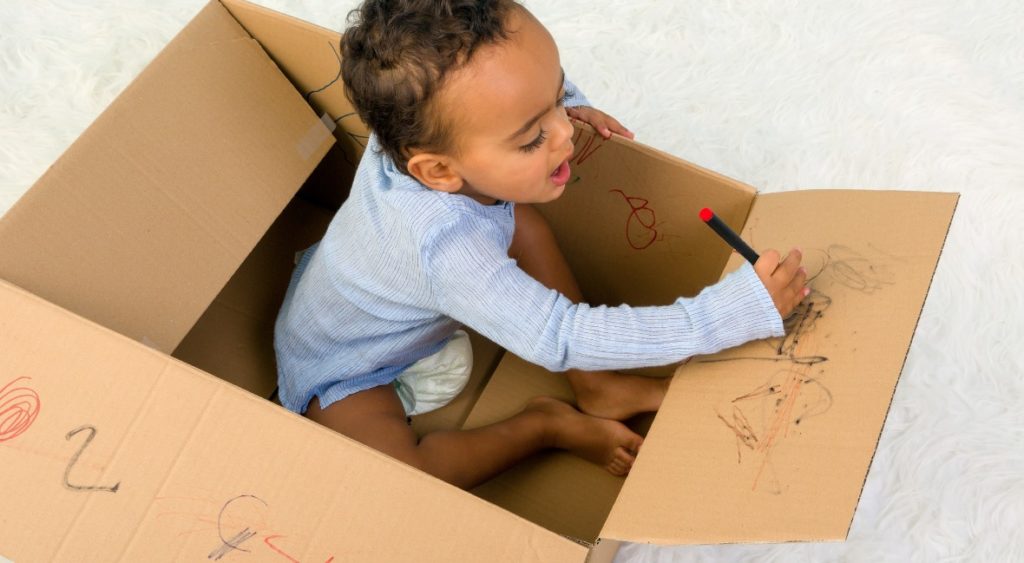 A cardboard box encourages open-ended play.