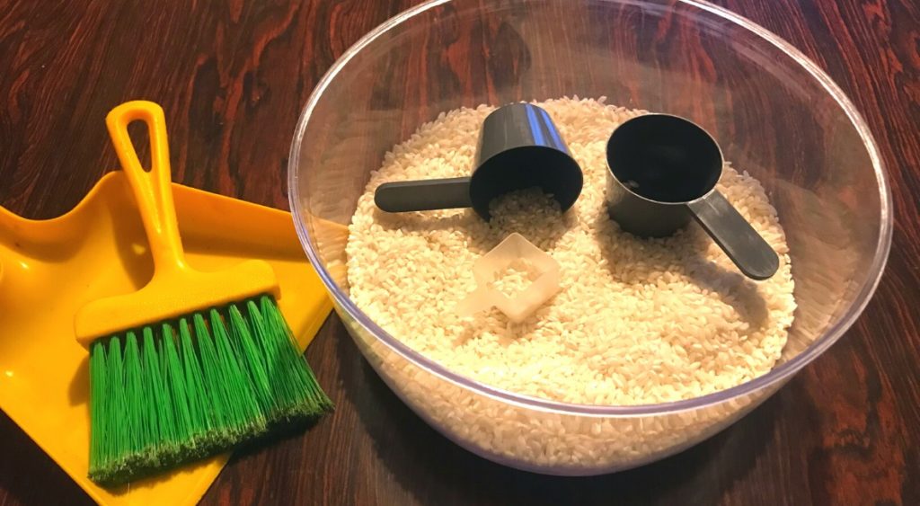Rice with scoops are an open-ended toy for kids.