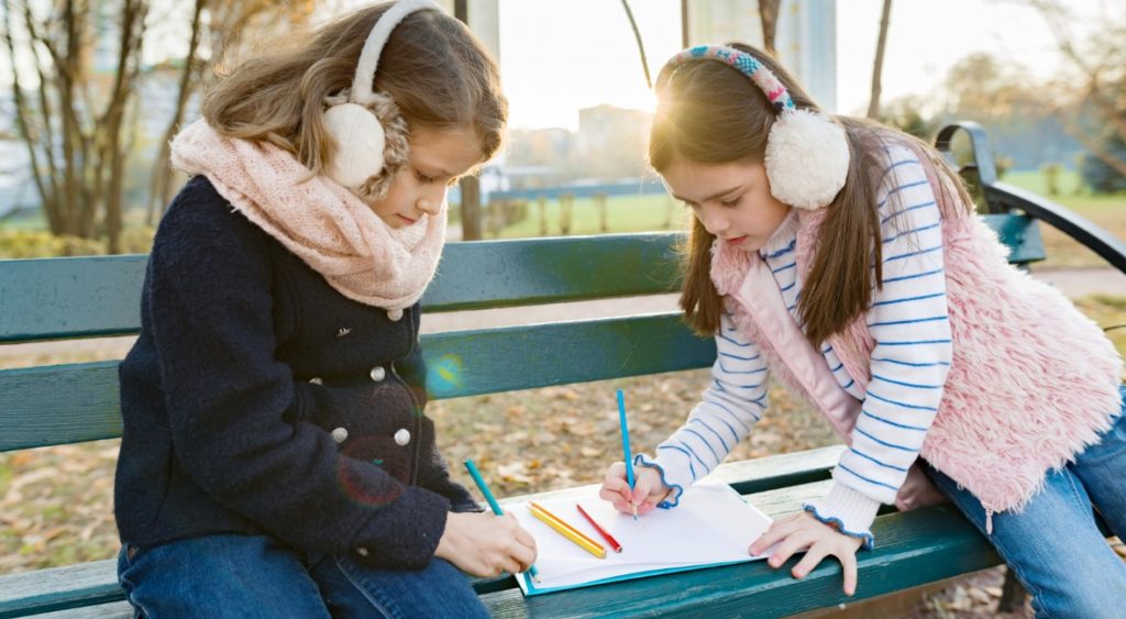 Kids drawing as a free outdoor activity