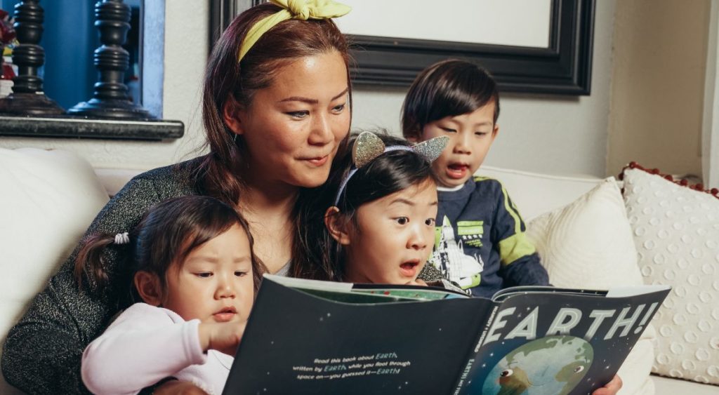 family reading book together builds literacy