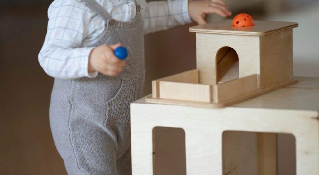 playing at a Montessori weaning table