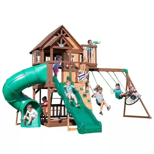 Backyard Discovery Skyfort All Cedar Swing Set, Elevated Covered Wood Roof Clubhouse with Bay Windows, 2 Belt Swings, Web Swing, 10ft Wave Slide, 5 ft Tube Slide, Covered Picnic Table, 5 ft Rock Wall