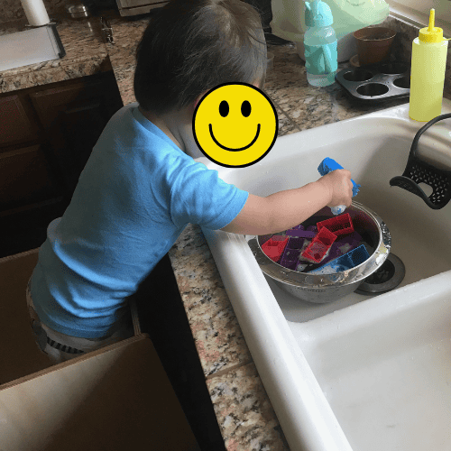 sensory play in a learning tower
