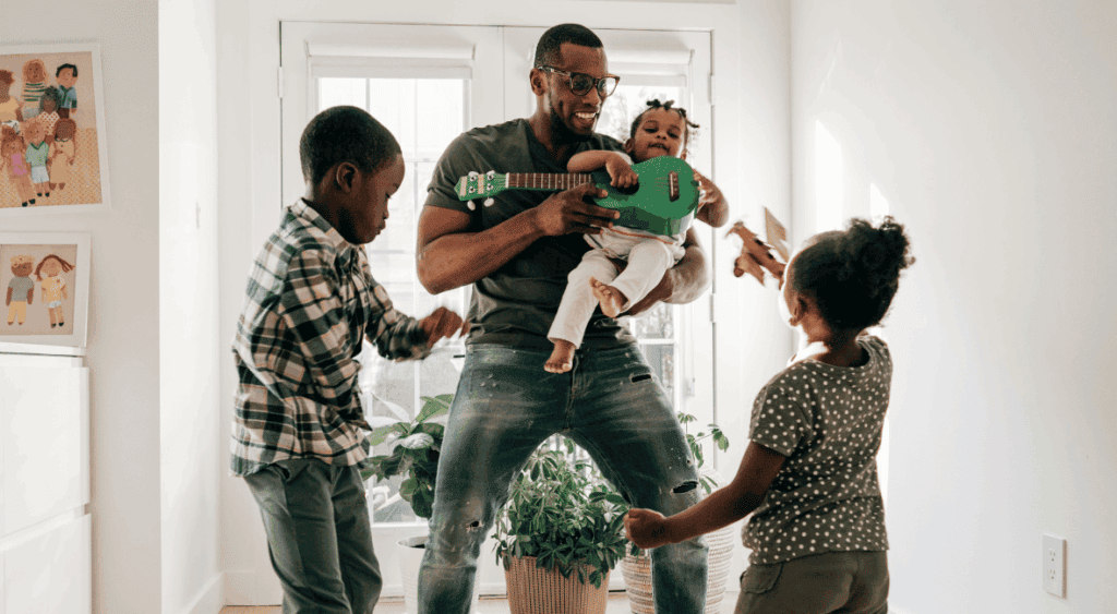 a dad play with his kids