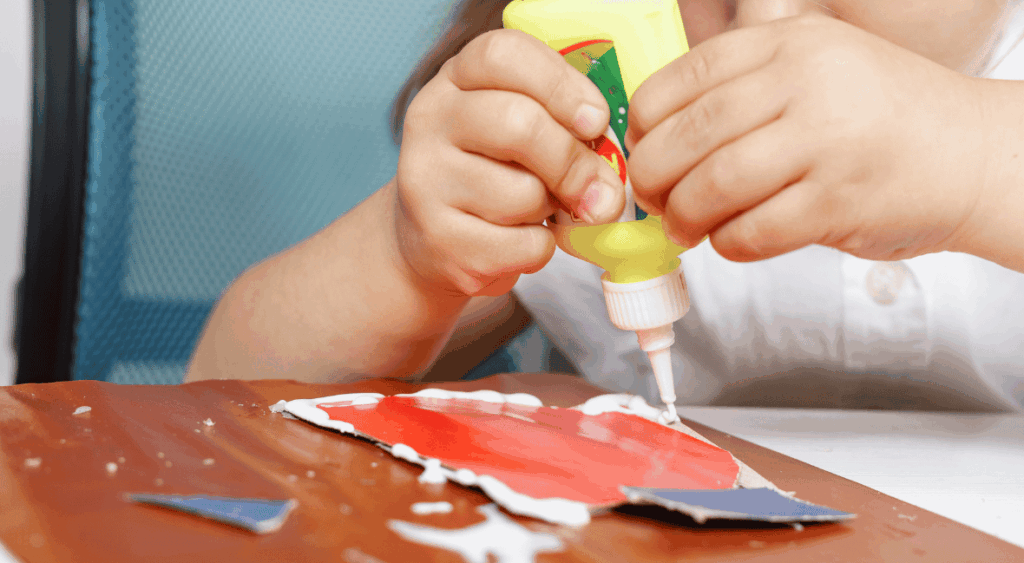 kid squeezing glue