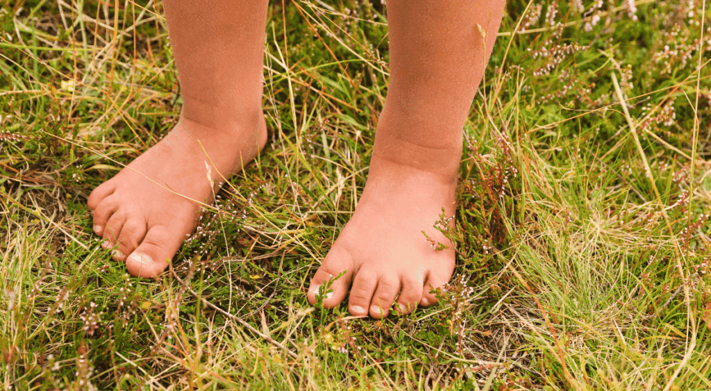 toddler exploring barefoot