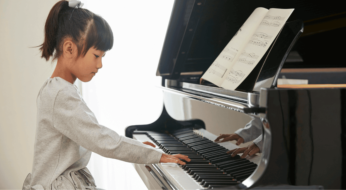 kid playing piano