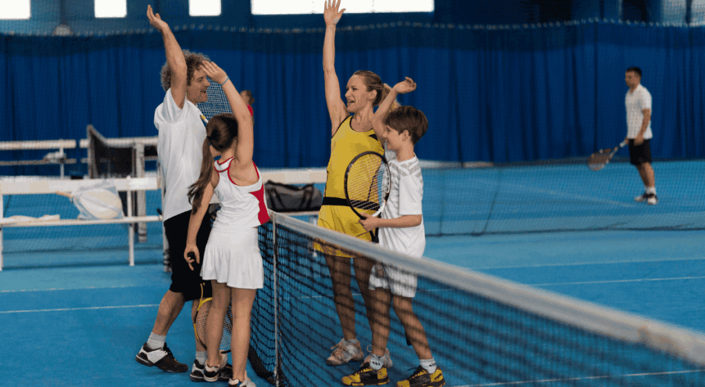 family playing tennis
