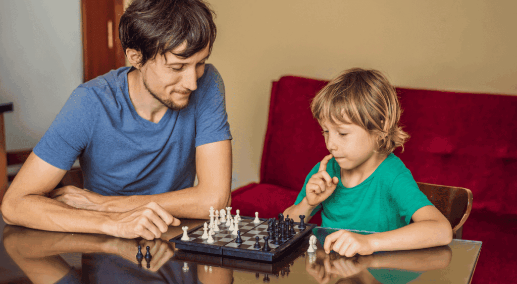dad and son playing chess