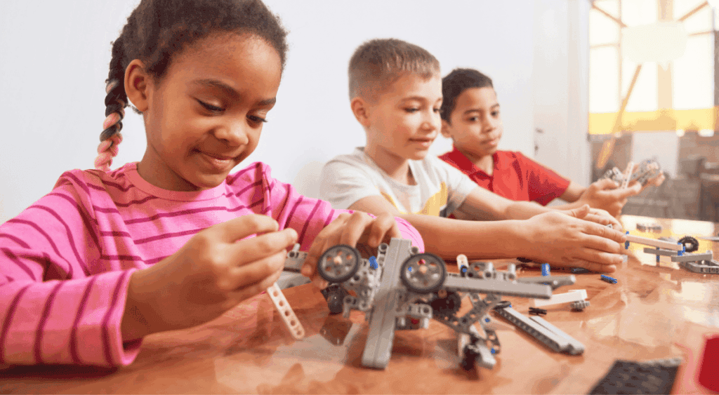 kids building with legos