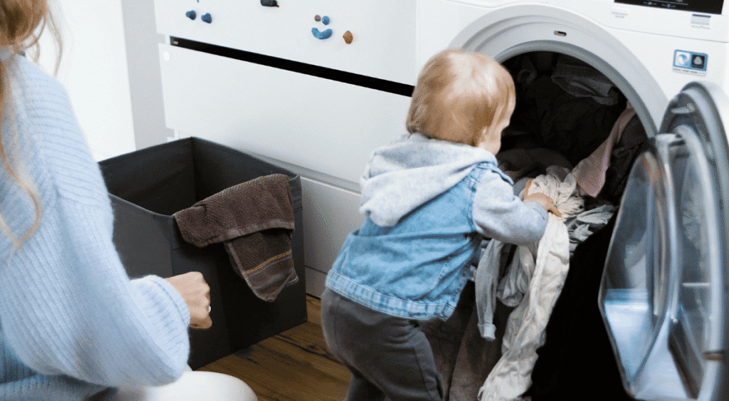 preschooler helping with laundry